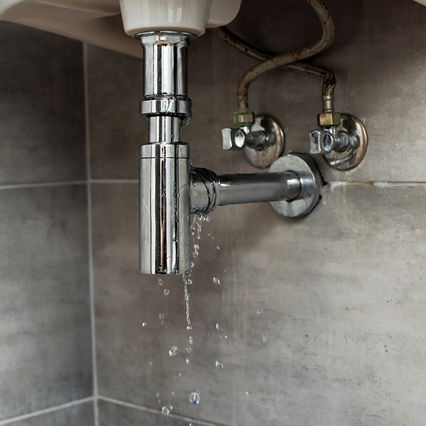 Steel pipes with water drops on grey background Leak Repair Near Me | Mr. Plumber Expert